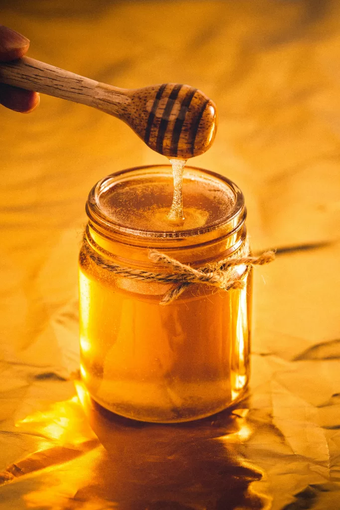 Fireweed honey in a glass jar showing very light color and clarity